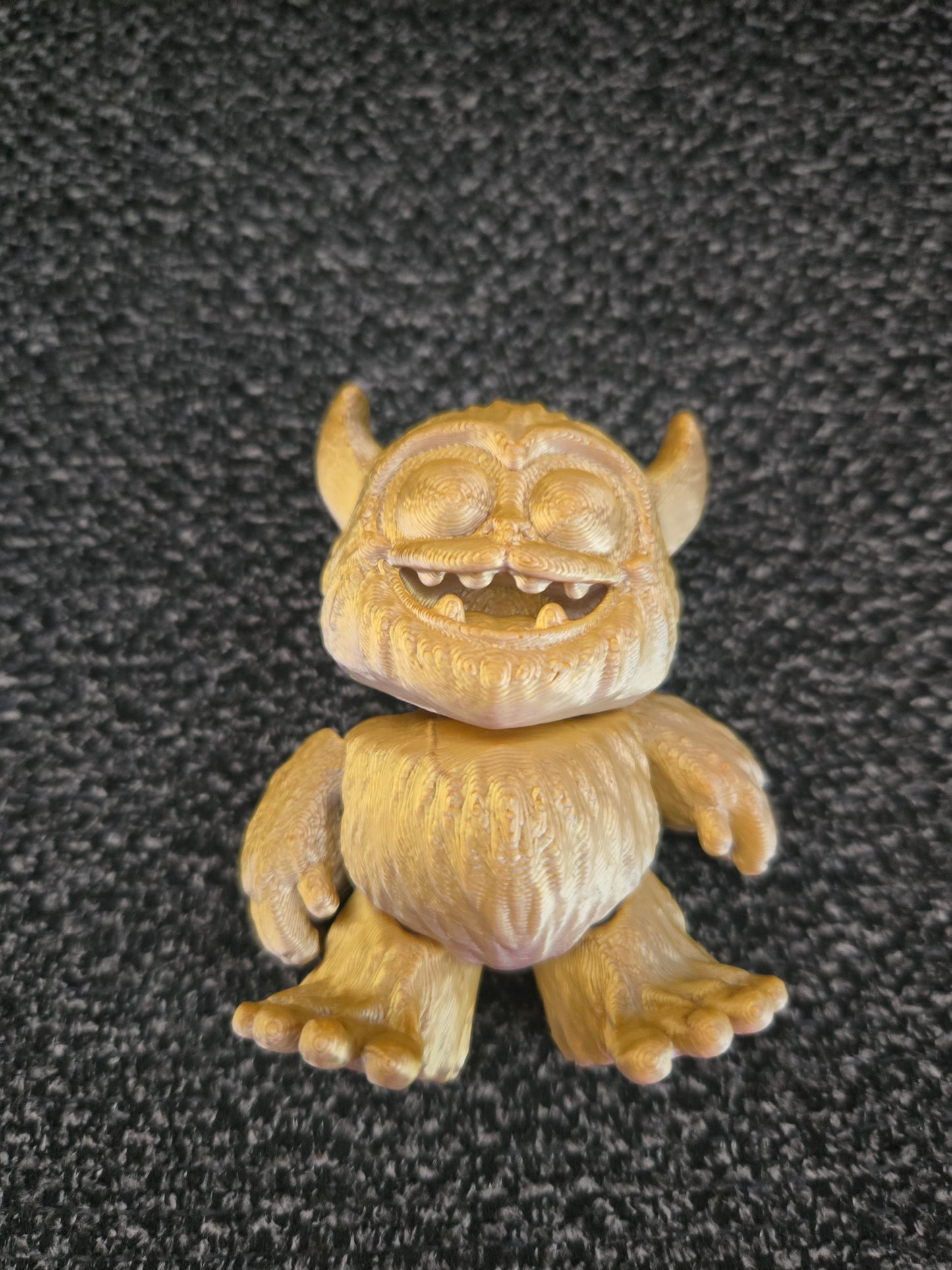Grumbles the Friendly Yeti 3D printed figurine front view showing toothy grin and tiny horns, colors may vary, made by Z Axis Rising