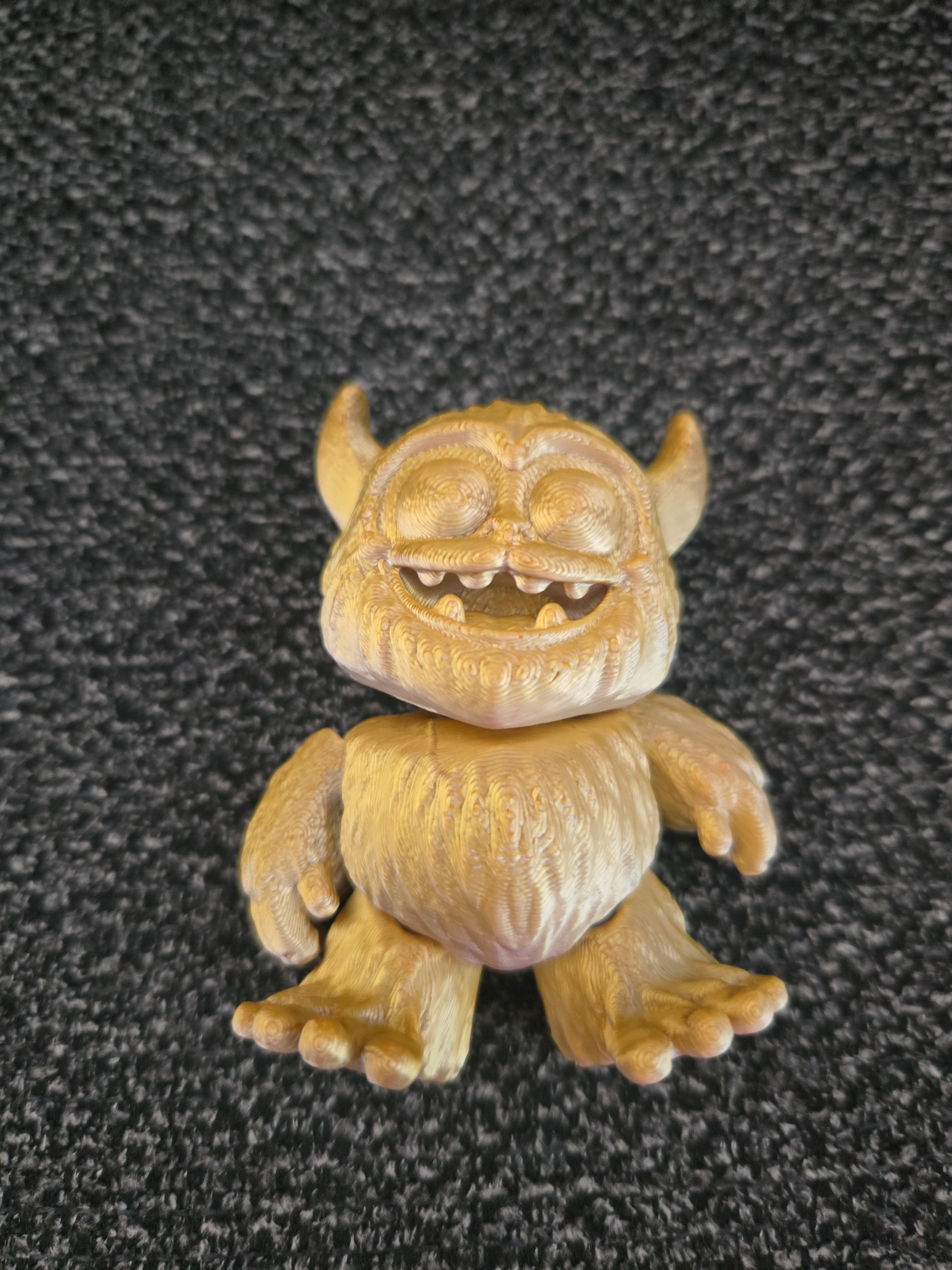 Grumbles the Friendly Yeti 3D printed figurine front view showing toothy grin and tiny horns, colors may vary, made by Z Axis Rising