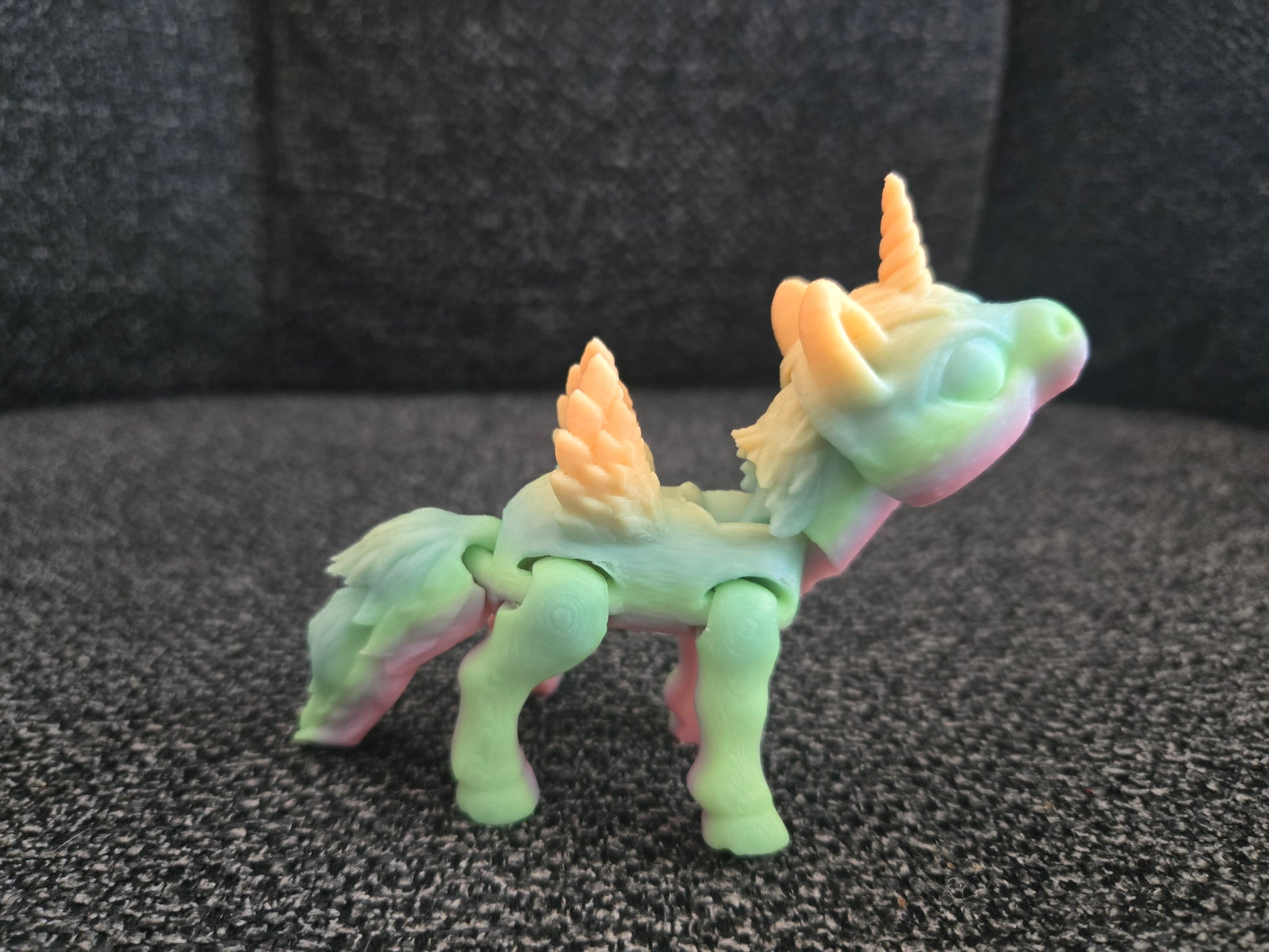 3D printed articulated mini unicorn with horn and wings, colors may vary