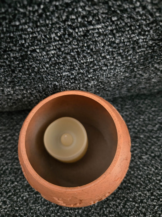 Top-down view of Falling Leaves Tea Light Vase showing battery-operated tea light candle inside