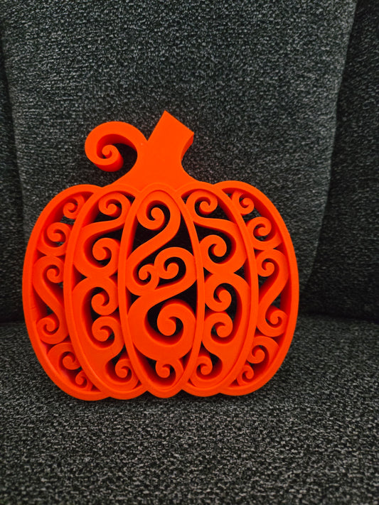 3D printed Swirly Pumpkin in solid orange with intricate filigree swirl design, front view