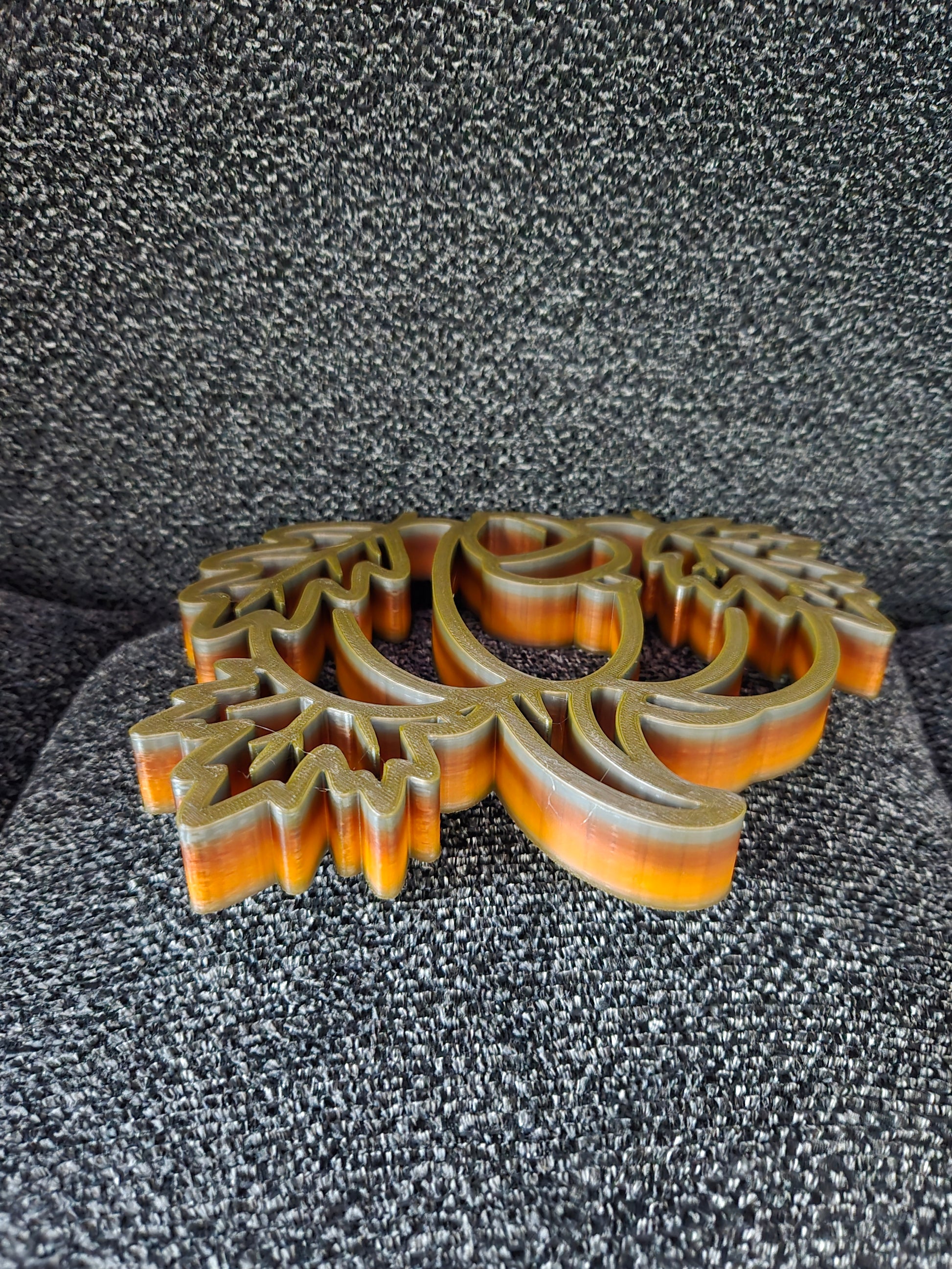 Side angle view of 3D printed Pumpkin Harvest Scene showing thickness and layered multicolor blended filament texture